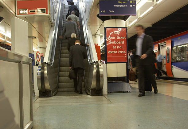 istock Escalator at the train station moving people 137233398