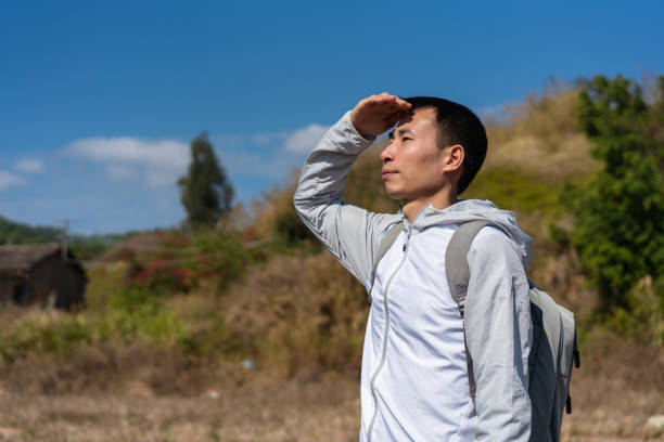 istock In the wild, man under the hot sun 1372334523