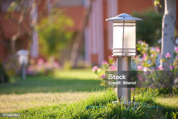 Outdoor Lamp On Yard Lawn For Garden Lighting In Summer Park Stock Photo - Download Image Now
