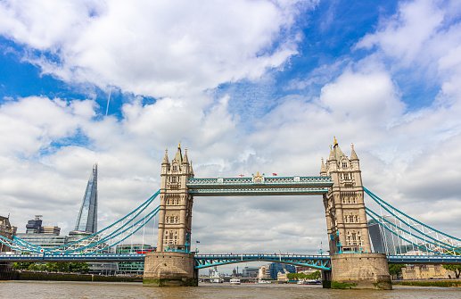 London Bridge Over Thames River Against Cloudy Sky