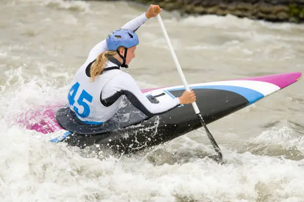 Canoe slalom athlete racing on white water