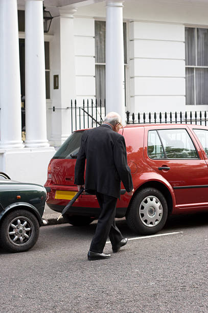 istock Dapper elderly gentleman walking in London street 137233771
