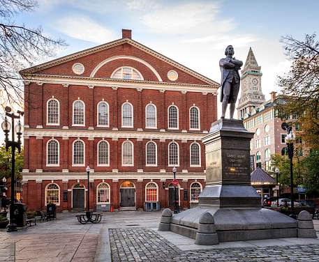 Boston, MA, USA - September 10, 2018: view of the historic architecture of Boston in Massachusetts, USA showcasing the Quincy Market and Faneuil Hall building at Government Center with lots of locals and tourists passing by.