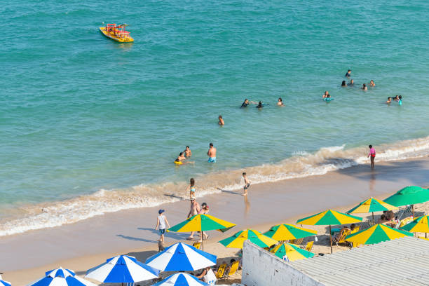 Ipojuca, PE, Brazil - October 15, 2021: aerial view of people on the beach of Porto de Galinhas on a sunny day.