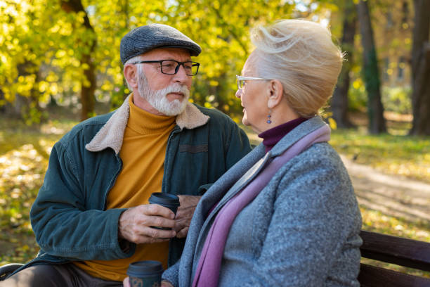 istock Senior couple sitting and drinking hot coffee. 1372340290