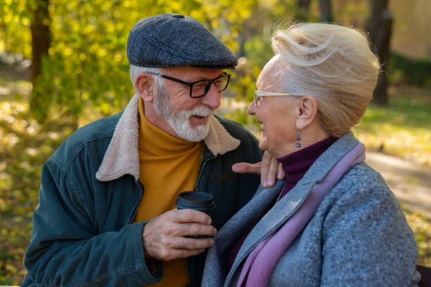 istock Senior couple sitting and drinking hot coffee. 1372340373