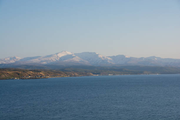 istock Quiet sea and snowy mountains in spring 1372341003