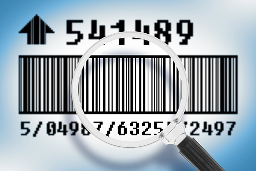 Linear bar code with magnifying glass - concept image