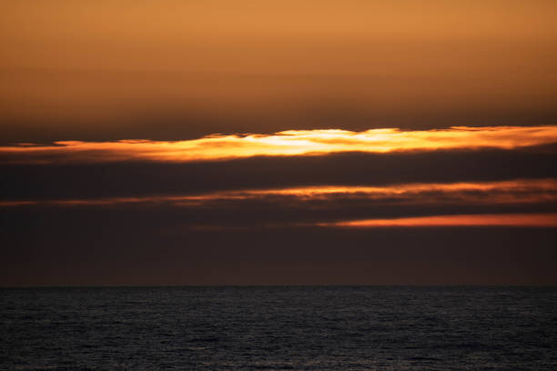 istock Beautiful dusk clouds in the calm sea 1372341424