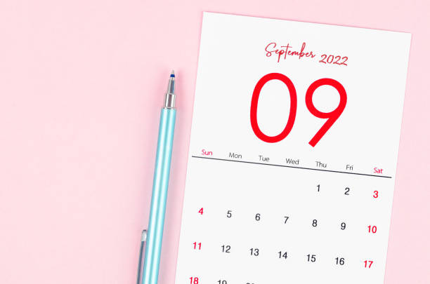 istock September 2022 calendar with pen on pink background. 1372344040