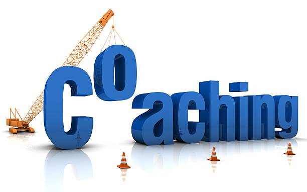 istock Coaching word art with crane dropping in the O 137234519