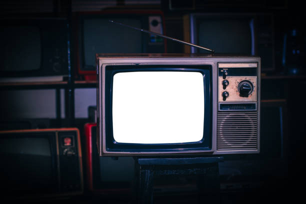 istock Vintage old  TV with white blank screen in room. 1372345198