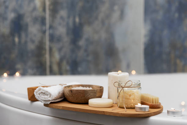 istock Hotel spa treatment or home bath procedure. Bathroom with accessories on tray 1372347151