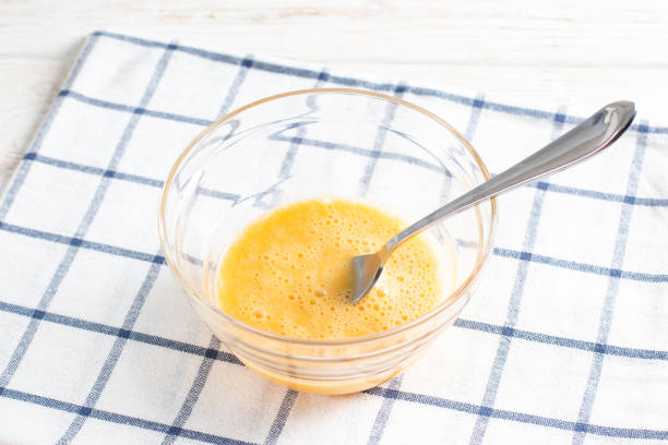 istock Whisking eggs in a glass bowl. 1372348035