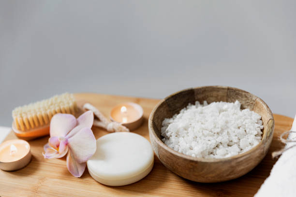 istock Hotel spa treatment or home bath procedure. Bathroom with accessories on tray 1372348308