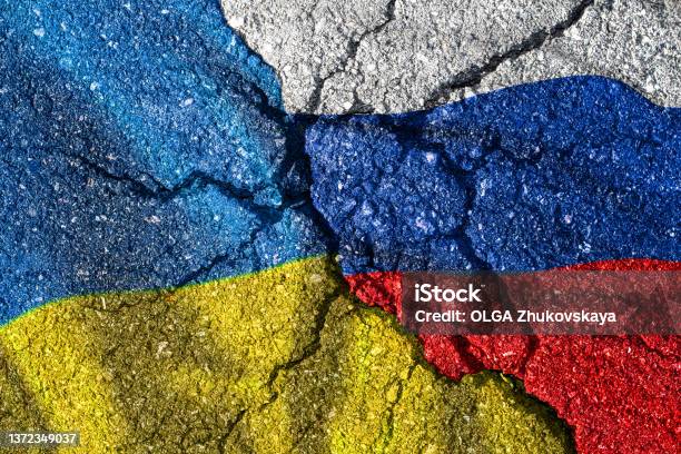 Ukraine And Russia Flag With Cracks Political Conflict Stock Photo - Download Image Now