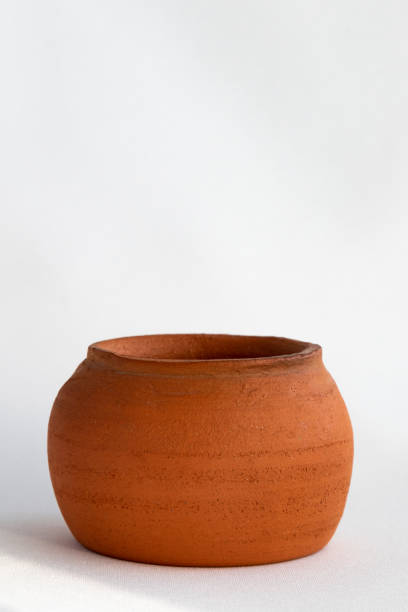 istock A vertical photograph of a clay pot on a white background. copy space 1372351252