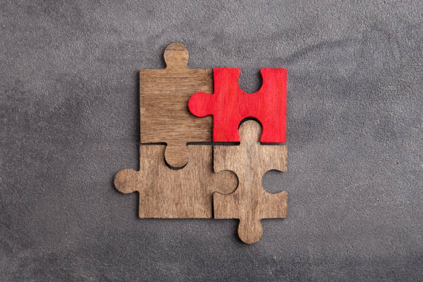 istock Creative idea and solve the problem concept. Teamwork success strategy - wooden puzzle on the grey background 1372351474