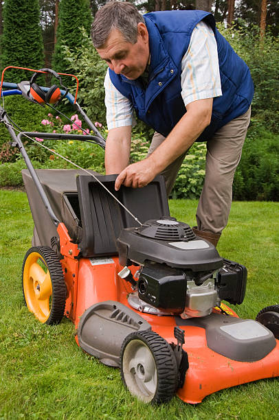 istock Senior man mowing the lawn 137235467