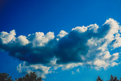 White clouds against a blue sky. Summer. Web banner.