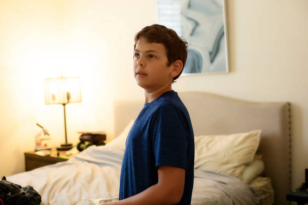 istock Teen in his room 1372355726