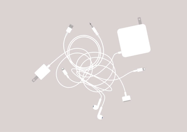 ilustrações, clipart, desenhos animados e ícones de um conjunto de carregadores de laptop e celular, cabos e fones de ouvido emaranhados em um grande nó - knotted wood