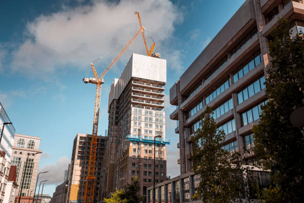 Cranes on the construction site of an apartment block stock photo