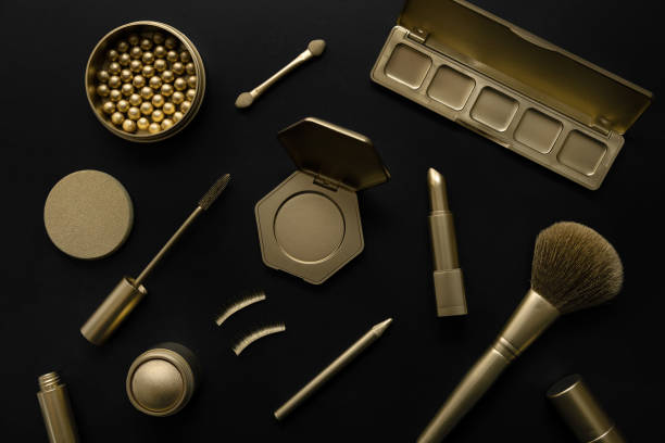 istock luxury cosmetics - set with golden decorative makeup products on black background. top view 1372363130