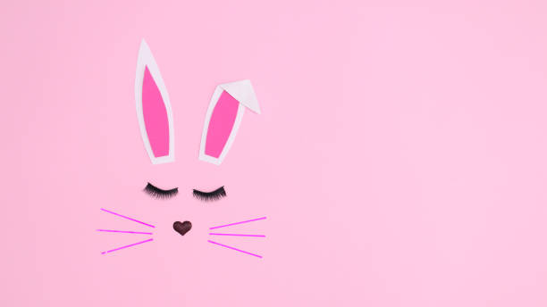 istock Creative monochrome Easter bunny on pastel pink background. Flat lay copy space concept. Spring holidays 1372363223