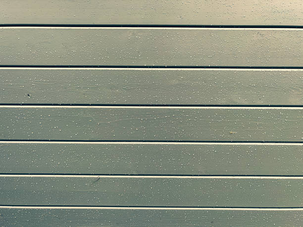 istock Wet light grey lacquered wooden wall. 1372364472