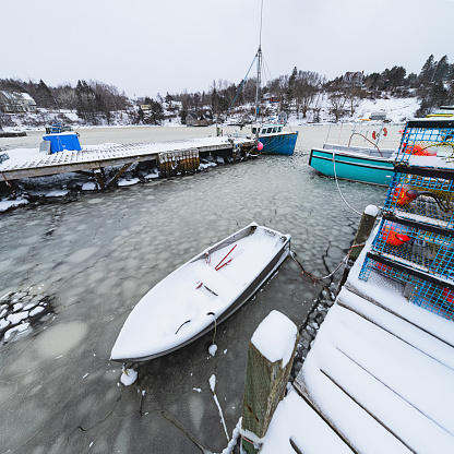A Nova Scotian fishing village during a Winter storm.