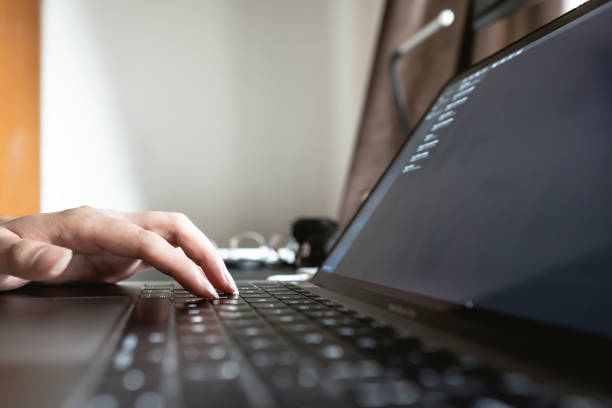 istock Close up view of hand typing on laptop keyboard 1372370792