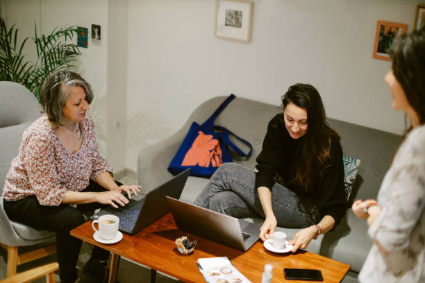 istock colleagues working together in a cafe 1372372029