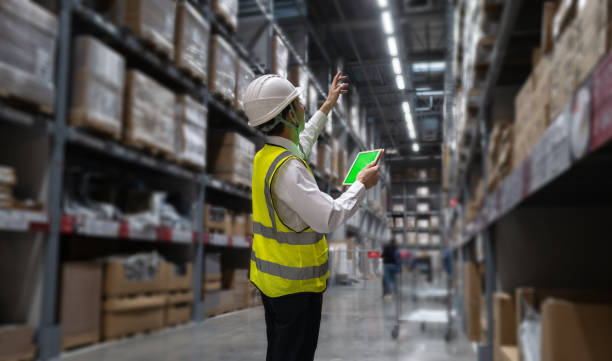 istock Male manager counting goods in warehouse 1372372404