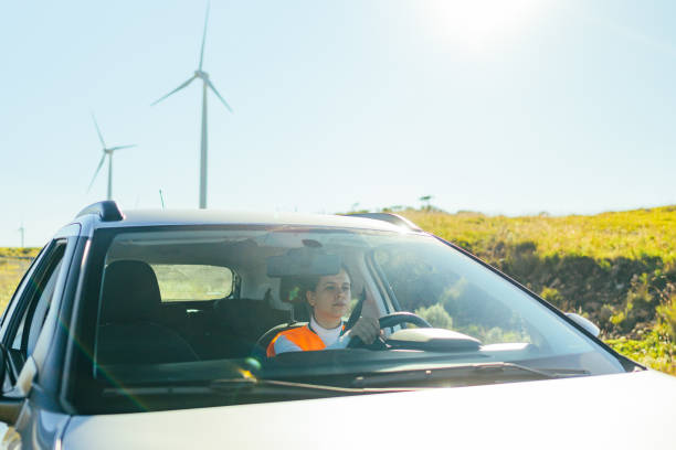 istock Wind energy worker arriving by car 1372372626