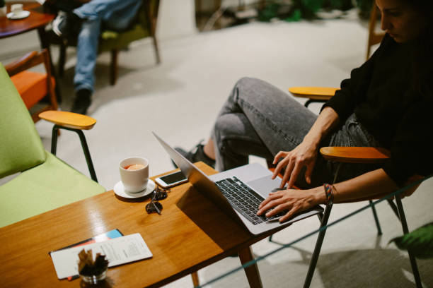 istock Young woman doing work at the laptop in a cafe 1372373560