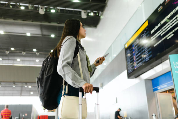 istock A business traveler looking at the flight board 1372373917