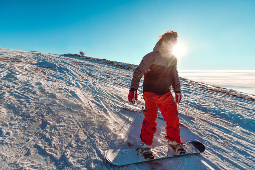 Male Snowboarder Enjoying Winter Fun Times