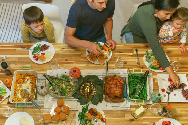 istock Family enjoying Thanksgiving dinner 1372375185