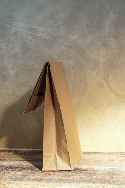 istock Wrap it from brown paper on a wooden table 1372375666