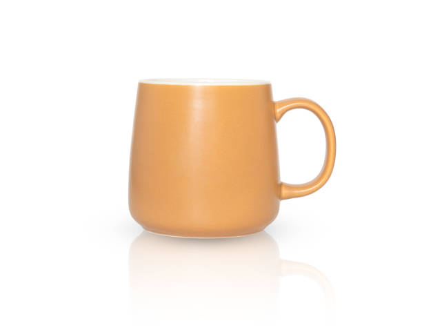 istock Beautiful beige ceramic cup isolated on white 1372376335