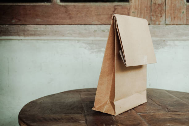 istock Wrap it from brown paper on a wooden table 1372376451