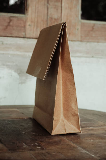 istock Wrap it from brown paper on a wooden table 1372376545
