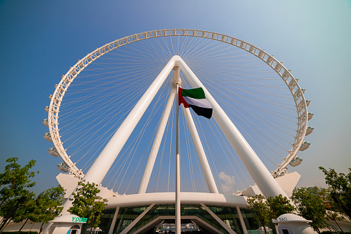 Dubai, UAE - November 06, 2021:  Ain (Eye) DUBAI - One of the largest Ferris Wheels in the World, located on Bluewaters island. Top tourist attractions in the United Arab Emirates