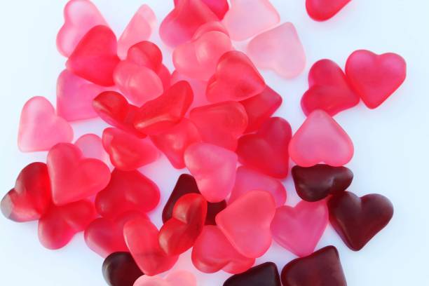 voluminous, translucent hearts in pink tones on a white background, bright color - valentine candy fotos imagens e fotografias de stock