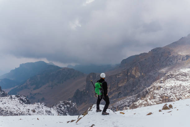 istock Hiker trekking in the mountains 1372378042