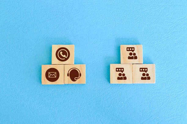 istock Wooden block with clients and customer service symbols. technical support assistant concept. 1372378245