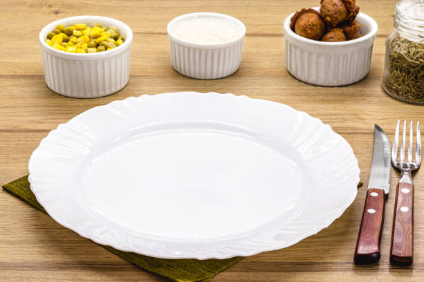 istock lunch and dinner table mockup, top view, empty plate for food, advertising use 1372379410
