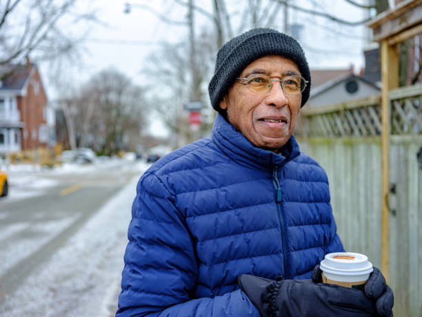 istock Senior Black man out for a winter walk and coffee 1372380565
