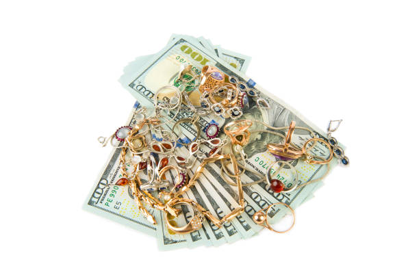 istock Dollars and jewelry isolated on white background. 1372383679